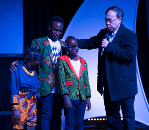 Pastor James Praying Over Church Members