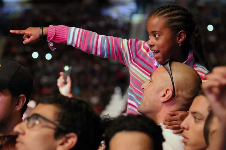 Getting a better vantage point to see some of her favorite artists sing.