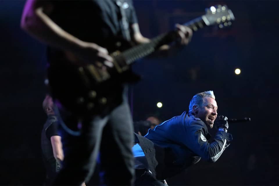 Trevor McNevan, lead singer of Thousand Foot Krutch, takes things low for a brief moment on Saturday night.