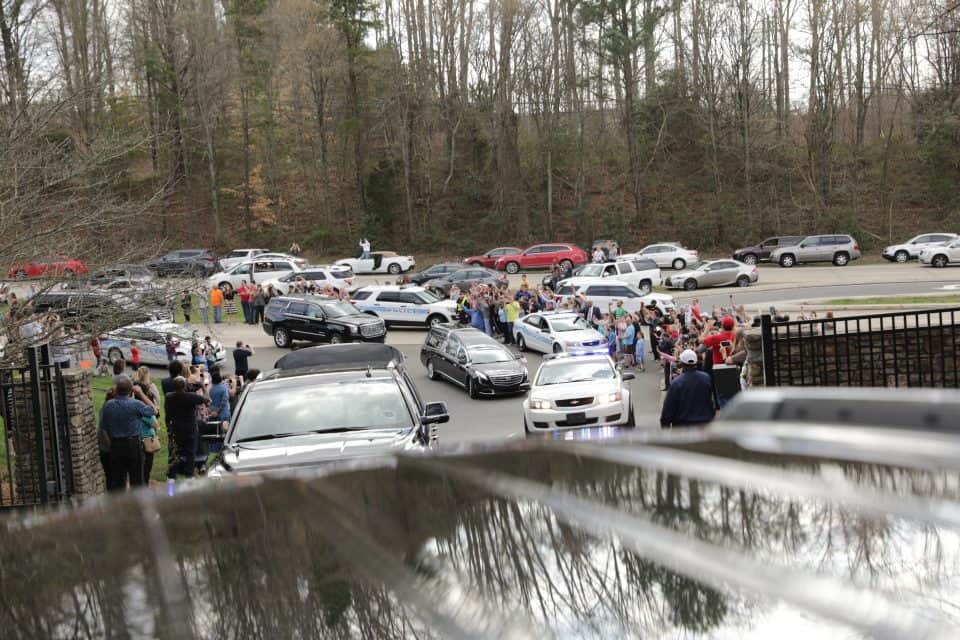 Onlookers just outside the entrance of the Billy Graham Library as the motorcade reached its destination. The 130-mile journey took about three-and-a-half hours.