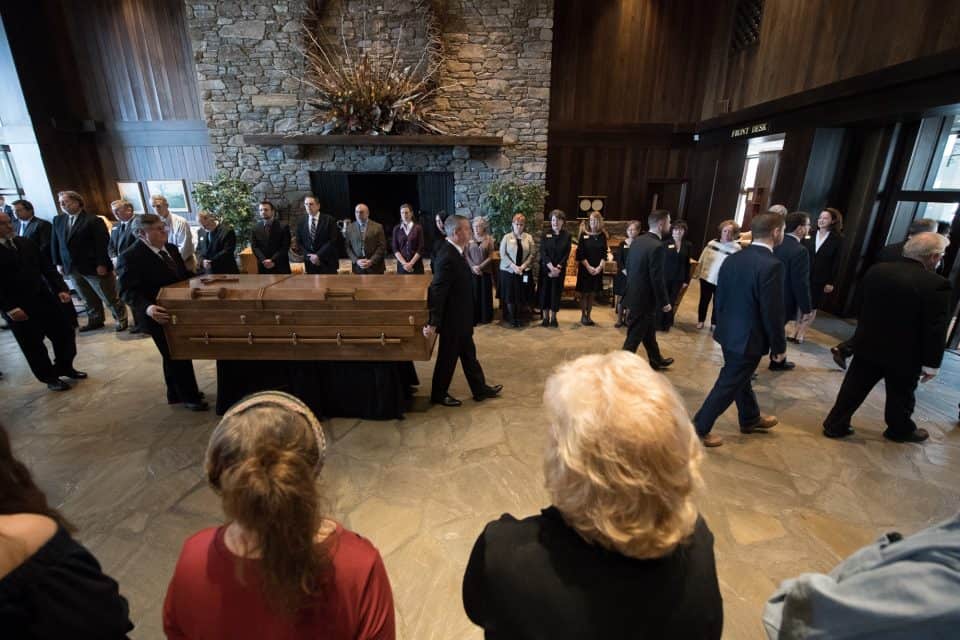 A private ceremony was held at the Billy Graham Training Center at The Cove in Asheville, North Carolina, on Saturday morning. Then, Billy Graham's casket was carried outside to the waiting hearse.