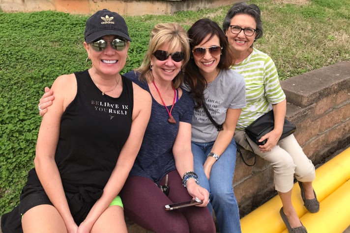 From left to right: Genia Rogers, Kat Wassung, Claudia Harthan and Azu Jorgensen. The four women gathered on the outskirts of uptown Charlotte to watch the motorcade pass by.