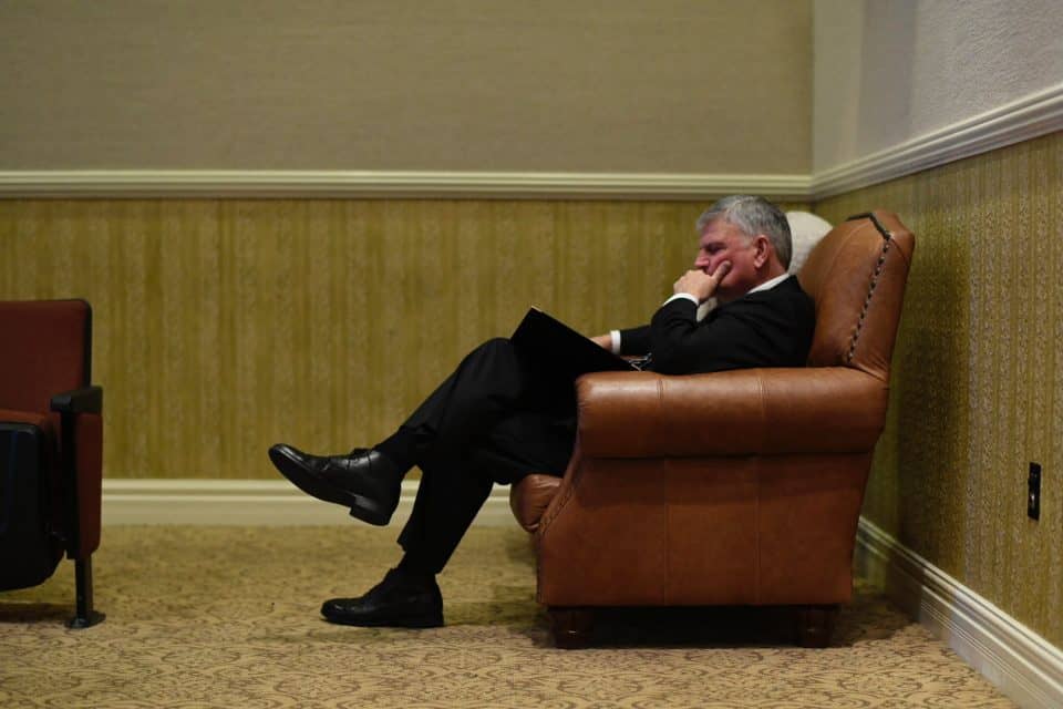 Franklin Graham pauses for a quiet moment on Friday. At the conclusion of his funeral remarks, he said, "Daddy, I won't see you on this earth again but I will see you again. I’ll see you maybe soon, but not yet. To God be the glory." 