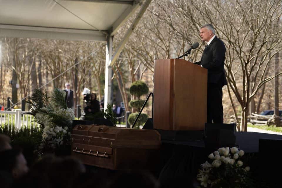 Billy Graham's simple pine plywood casket topped with a wooden cross was crafted by an inmate serving a life sentence at the Louisiana State Penitentiary in Angola, Louisiana. Franklin Graham chose the caskets for his father and mother after seeing them during a 2005 preaching engagement at the prison.