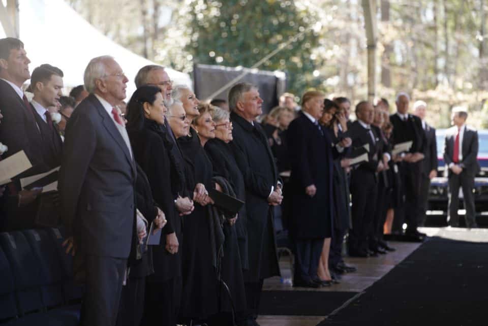 "Oh come to the Father through Jesus the Son, and give Him the glory, great things He hath done." The congregation sang "To God Be The Glory" toward the end of Friday's ceremony.