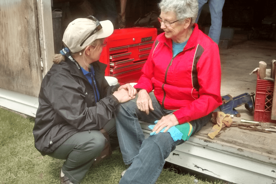 A Rapid Response Team chaplain encourages a home owner who was affected by flooding in New Brunswick.