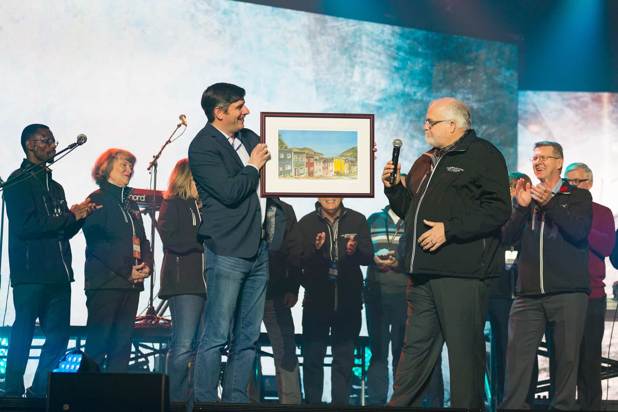 “Thank you for the invitation to come. I love being here.” Lorne Pritchett, the Avalon Celebration's committee co-chair, presented Will Graham with a thank you gift of a painting featuring Jelly Bean Row in St. John's.