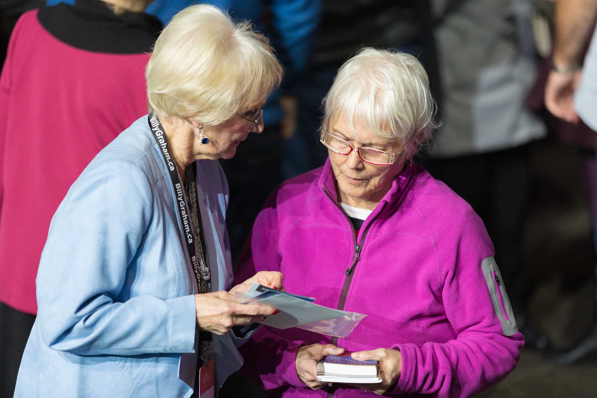 Prayer volunteers play a key role in gathering information from those who walk forward so they can be connected to a local church and receive other resources for growing their faith.