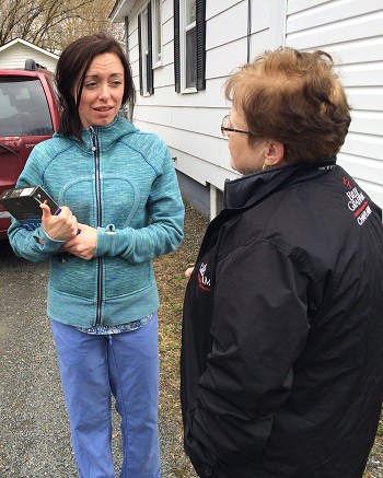 Rapid Response Team chaplain Cheryle Pagarigan (right) connects with a New Brunswick flood victim.