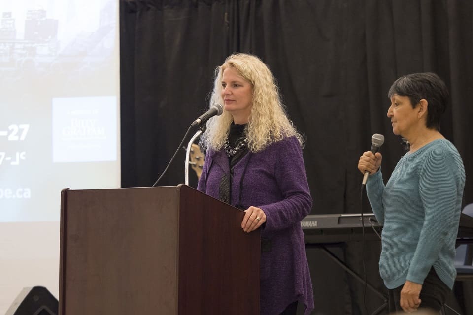 Kathy translating for BGEA guest speaker Cindy Martin at the Baker Lake Celebration of Hope Launch event