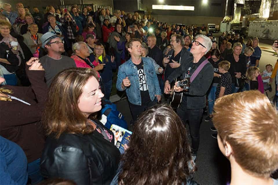 Music artists Josh Havens and Matt Maher make the most of a fire alarm evacuation during the Quinte Celebration of Hope with Will Graham by singing praises in the midst of waiting.