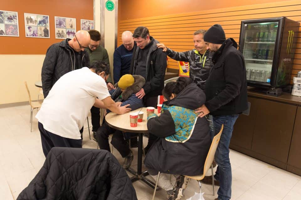 During a stop at Tim Hortons, Will Graham and his team stopped to pray with two residents of Baker Lake.