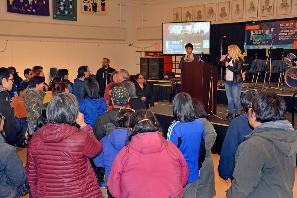 Connie Jakab (right) shares her testimony with 120 youth at FM419.