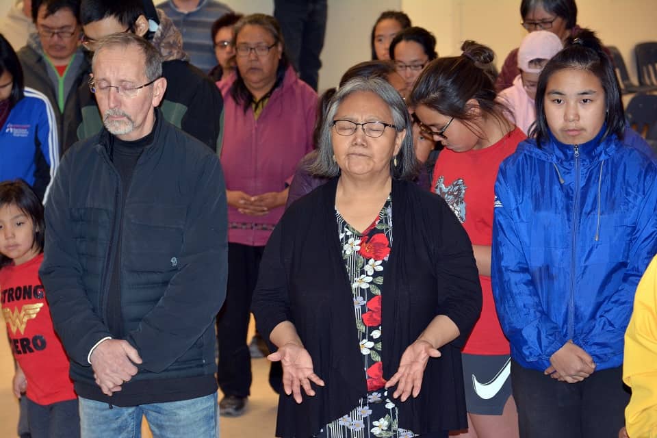 Baker Lake residents pray for revival in their community at Momentum event.