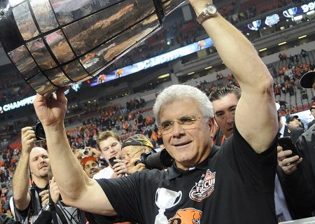 Wally Buono holds the Grey Cup in 2011 after winning his second Canadian Football League championship with the B.C. Lions. As a coach, Wally won five Grey Cups—three with the Stampeders and two with the Lions.