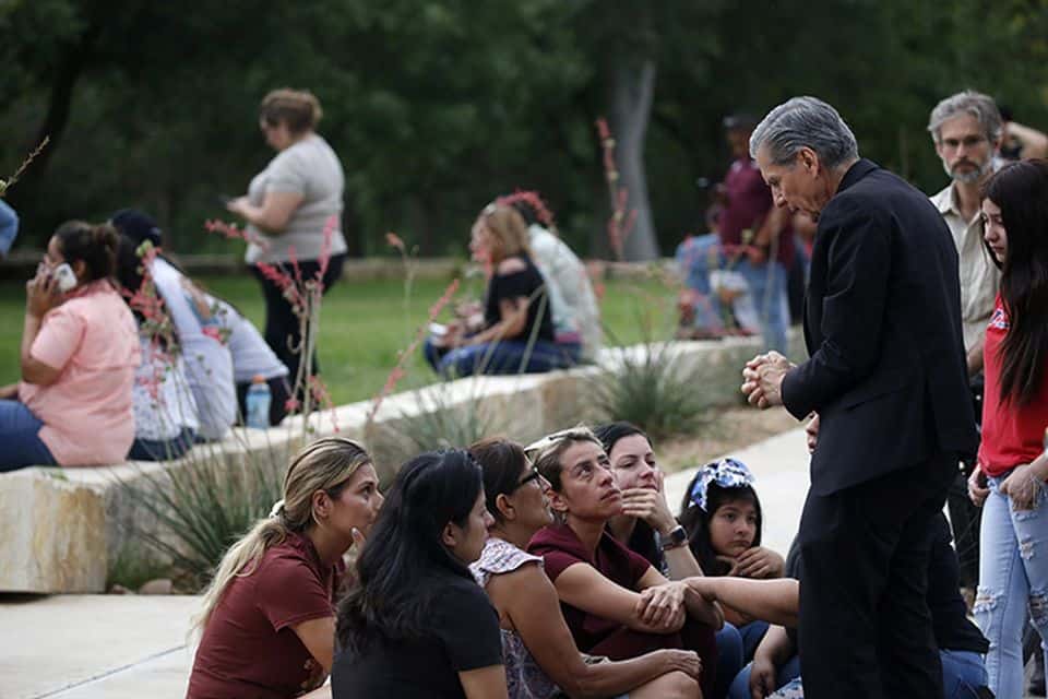 The Archbishop of San Antonio, Gustavo Garcia Seller, comforts families outside the Civic Center following a deadly school shooting at Robb Elementary in Uvalde, Texas. Billy Graham chaplains are headed to the scene of this unimaginable tragedy. (AP Photo/Dario Lopez-Mills)