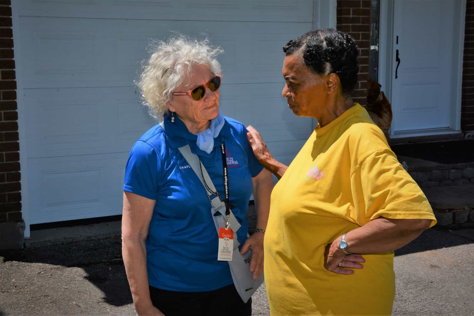 A Billy Graham chaplain comforts a woman who was impacted by the Ottawa storm.
