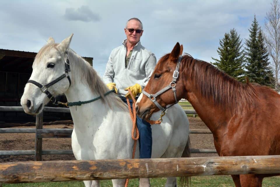 Former Calgary Herald publisher Dan Gaynor spends time with his horses in southern Alberta.