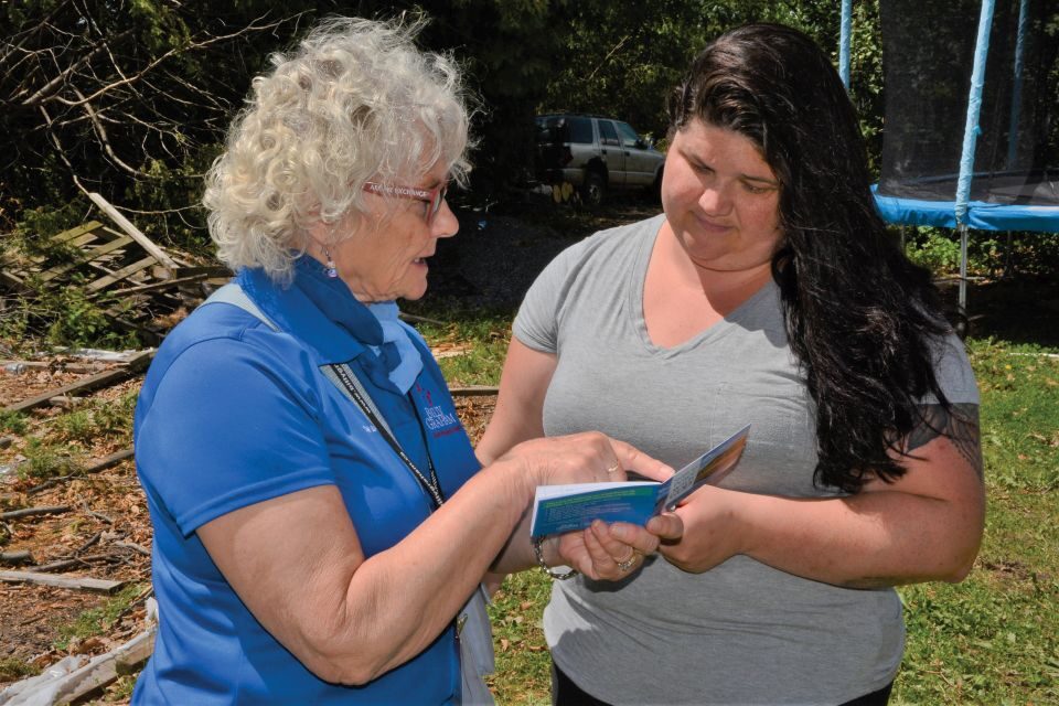 Selma, a crisis-trained BG-RRT chaplain, explains the Gospel to an Ottawa resident whose home was damaged by a vicious storm.