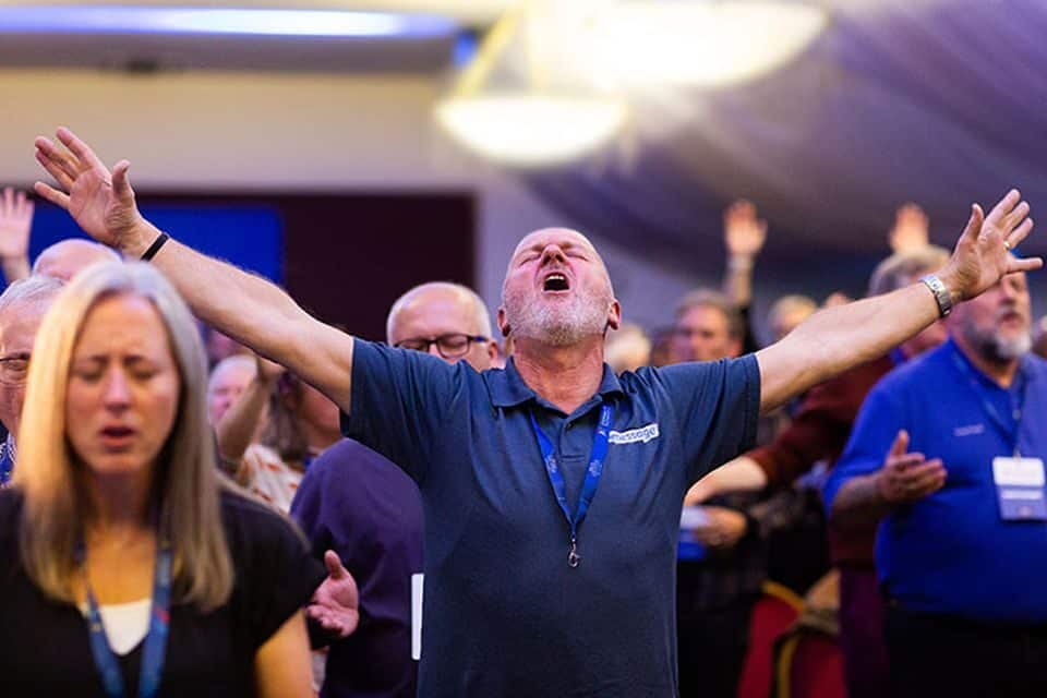 Pastors and ministry leaders worship God at the Billy Graham Evangelistic Association's Evangelism Summit in Liverpool.