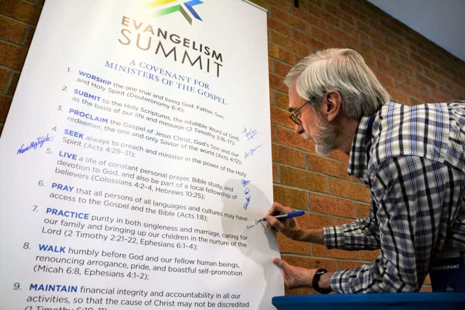 Evangelism Summit attendees were encouraged to sign a banner that proclaimed the goals of the Summit.