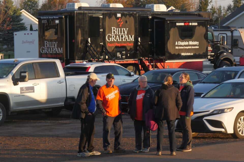 The Billy Graham Mobile Ministry Center (background) offers a retreat for people seeking prayer.