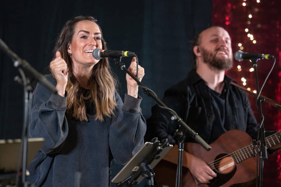 Hay River, Northwest Territories: Canadian Brooke Nicholls led the crowd in worshiping Almighty God who sent His Son Jesus to save us from our sins. At Christmas, we celebrate the birth of the Savior.