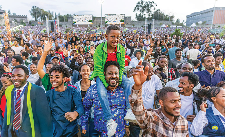 Crowd worshiping with joy